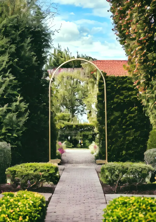 Simple metal wedding arch framing a garden walkway, showing customizable outdoor ceremony structures.