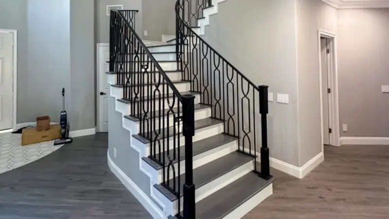 Custom metal railing installed on modern indoor staircase