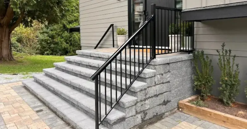 Custom metal railing installed on modern indoor staircase